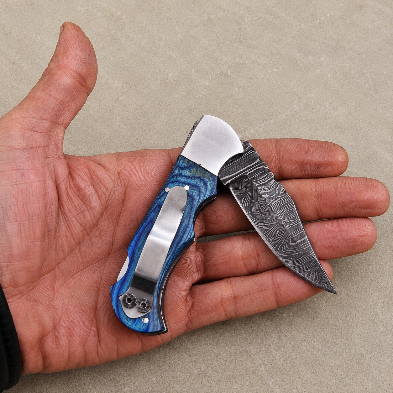 Personalized Damascus Folding Knife – Blue Pakka Wood Handle, Steel Bolster, Back Lock & Leather Sheath | Custom Engraved Gift