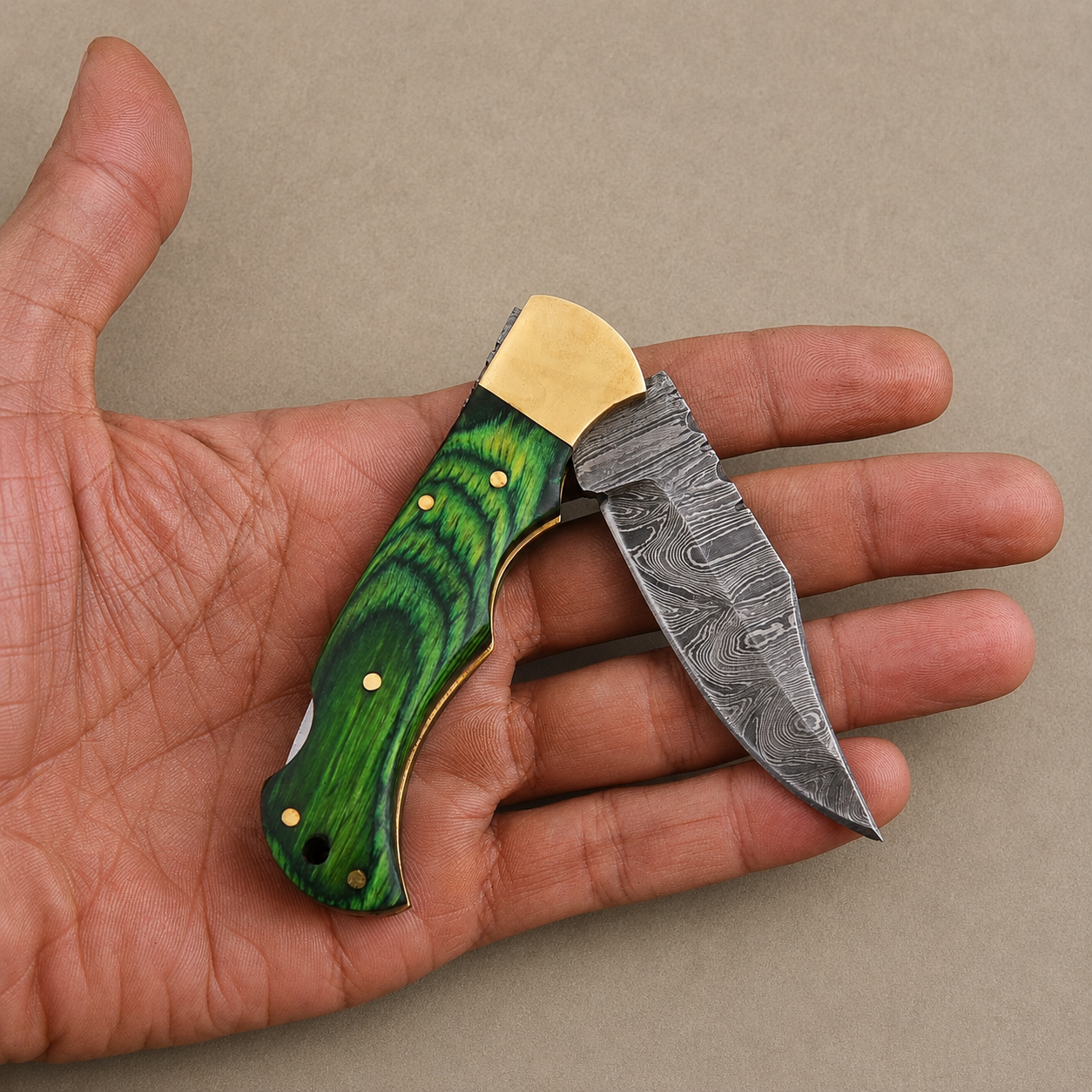 Emerald Ridge Damascus Folding Knife – Hand Forged Steel with Green Pakka Wood Handle, Brass Bolster & Leather Sheath