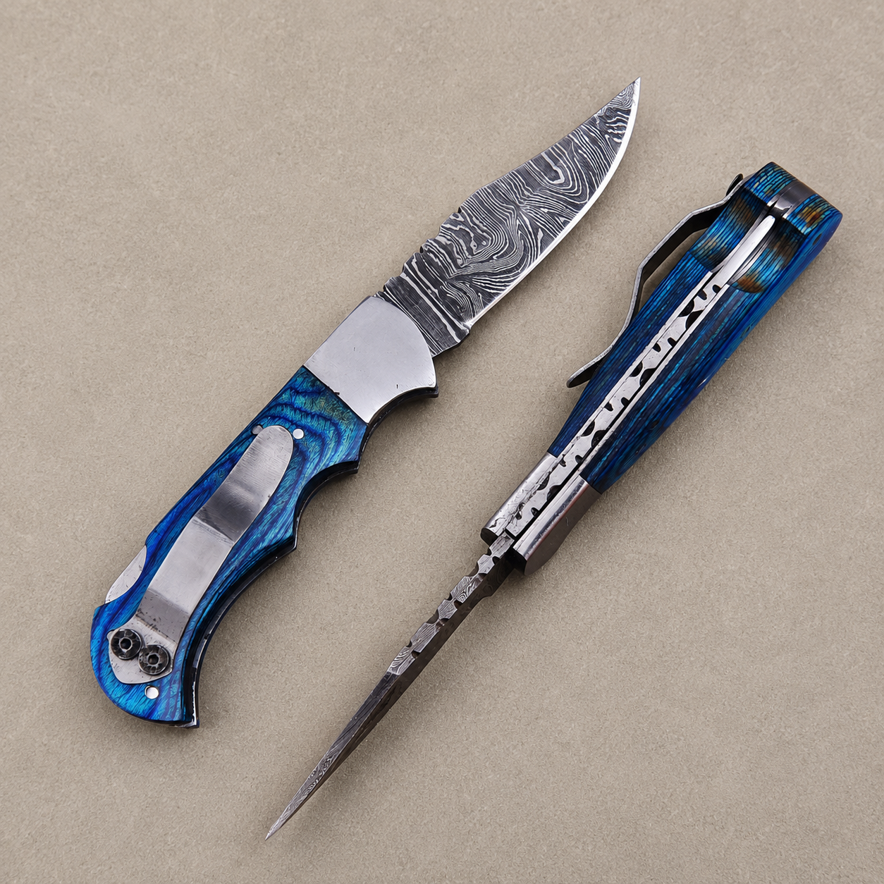 Personalized Damascus Folding Knife – Blue Pakka Wood Handle, Steel Bolster, Back Lock & Leather Sheath | Custom Engraved Gift