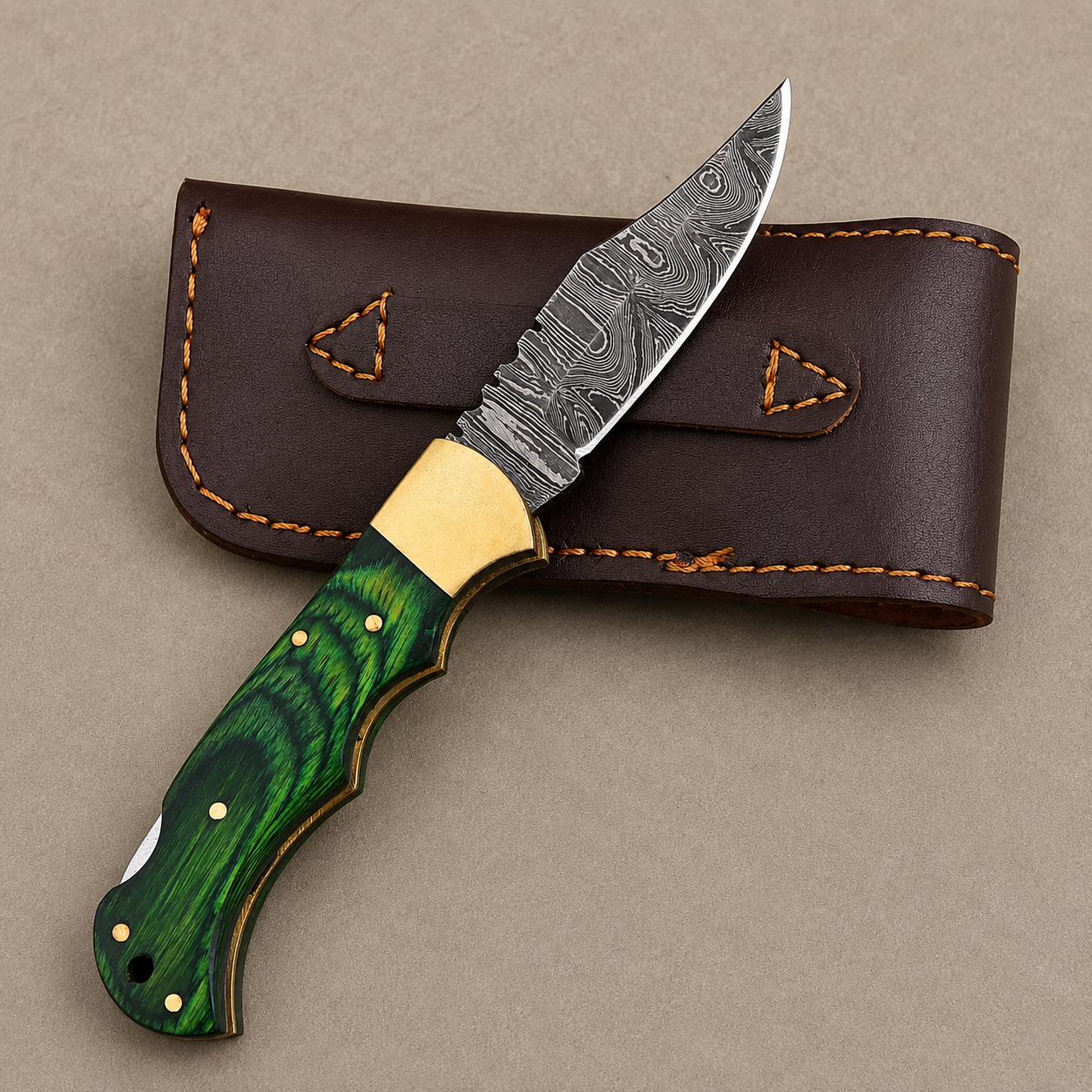 Emerald Ridge Damascus Folding Knife – Hand Forged Steel with Green Pakka Wood Handle, Brass Bolster & Leather Sheath
