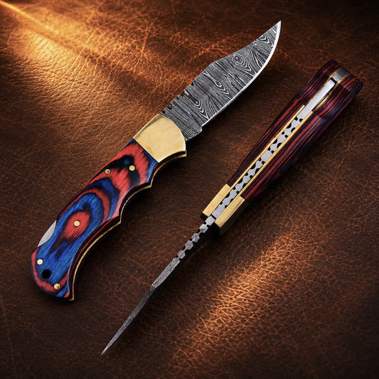 Heritage Damascus Folding Knife – Hand Forged Steel with Pukka Wood Handle, Brass Bolster & Leather Sheath
