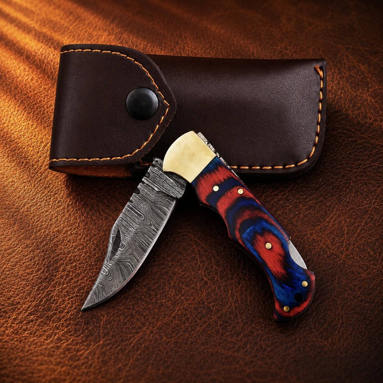 Heritage Damascus Folding Knife – Hand Forged Steel with Pukka Wood Handle, Brass Bolster & Leather Sheath