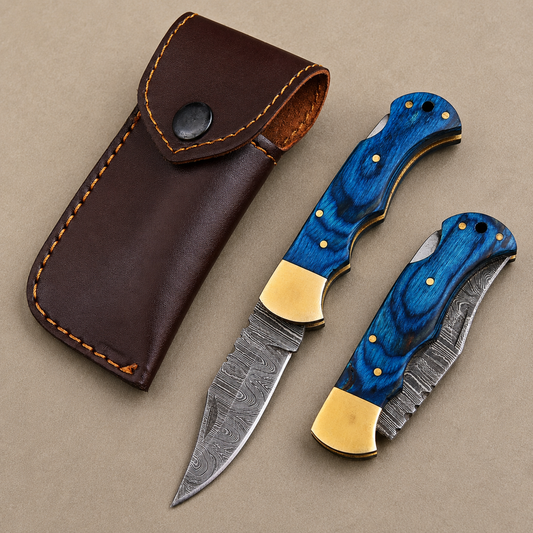 Cobalt Crest Damascus Folding Knife – Hand Forged Steel with Blue Pakka Wood Handle, Brass Bolster & Leather Sheath