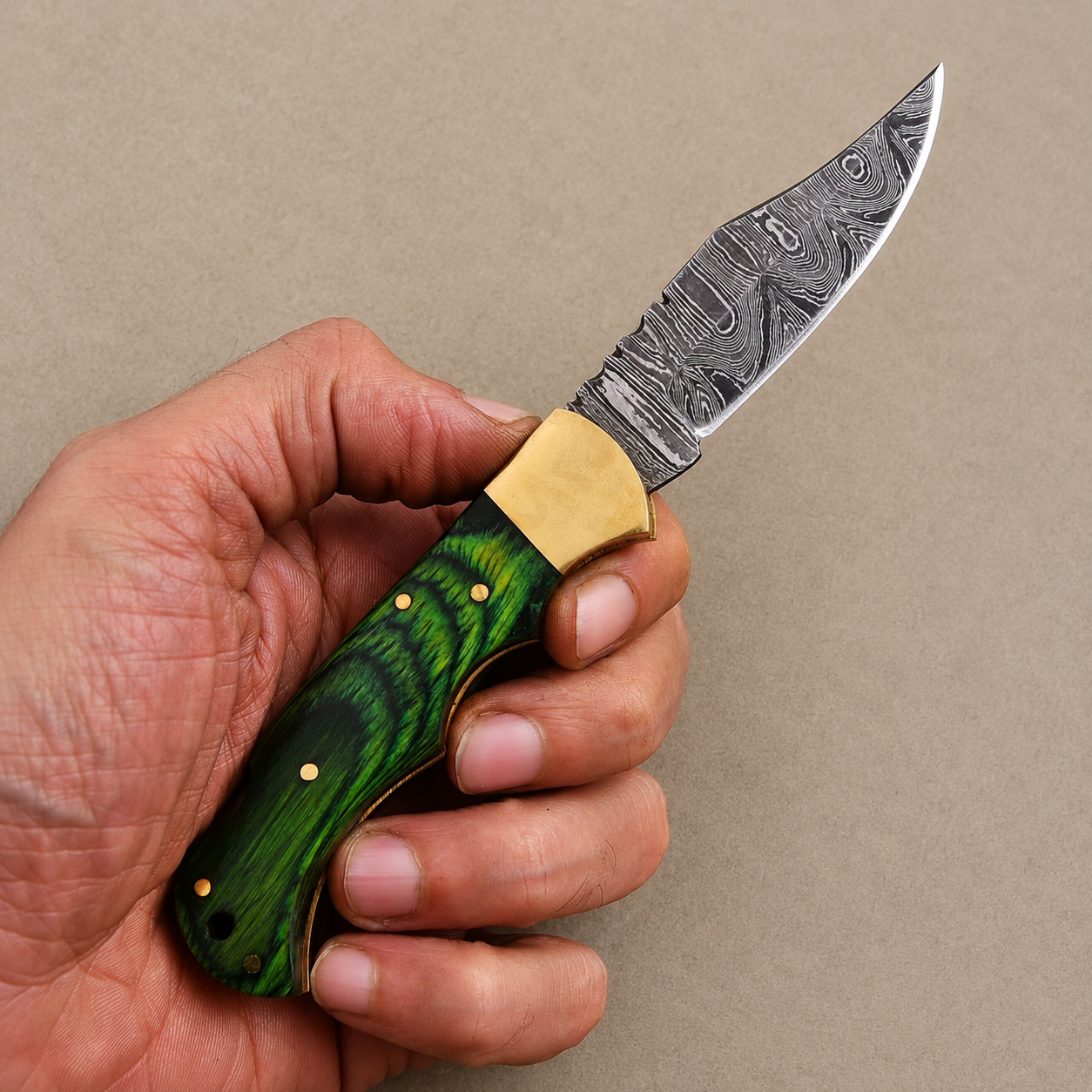 Emerald Ridge Damascus Folding Knife – Hand Forged Steel with Green Pakka Wood Handle, Brass Bolster & Leather Sheath