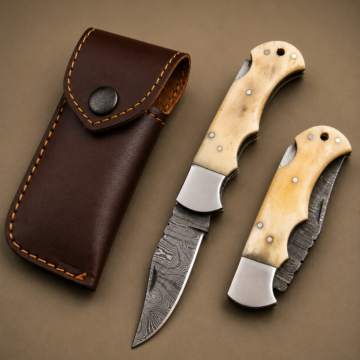 Ivory Peak Damascus Folding Knife – Premium Ivory Horn Handle, Steel Bolster & Leather Sheath