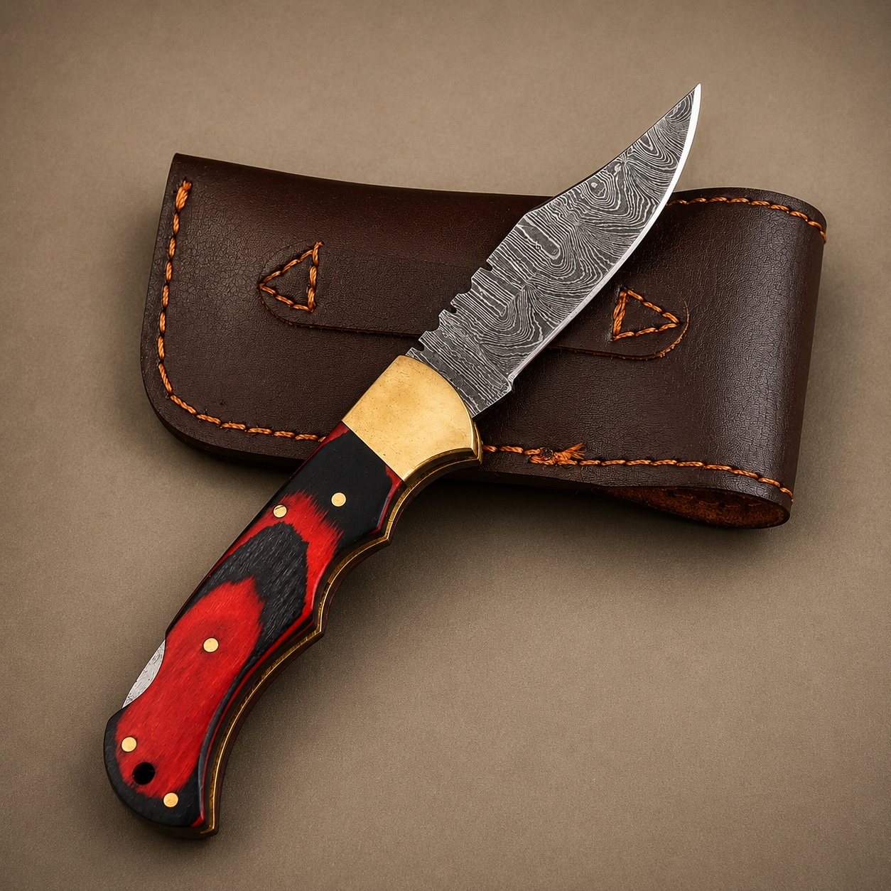 Crimson Oak Damascus Folding Knife – Red & Black Pakka Wood Handle, Brass Bolster & Leather Sheath